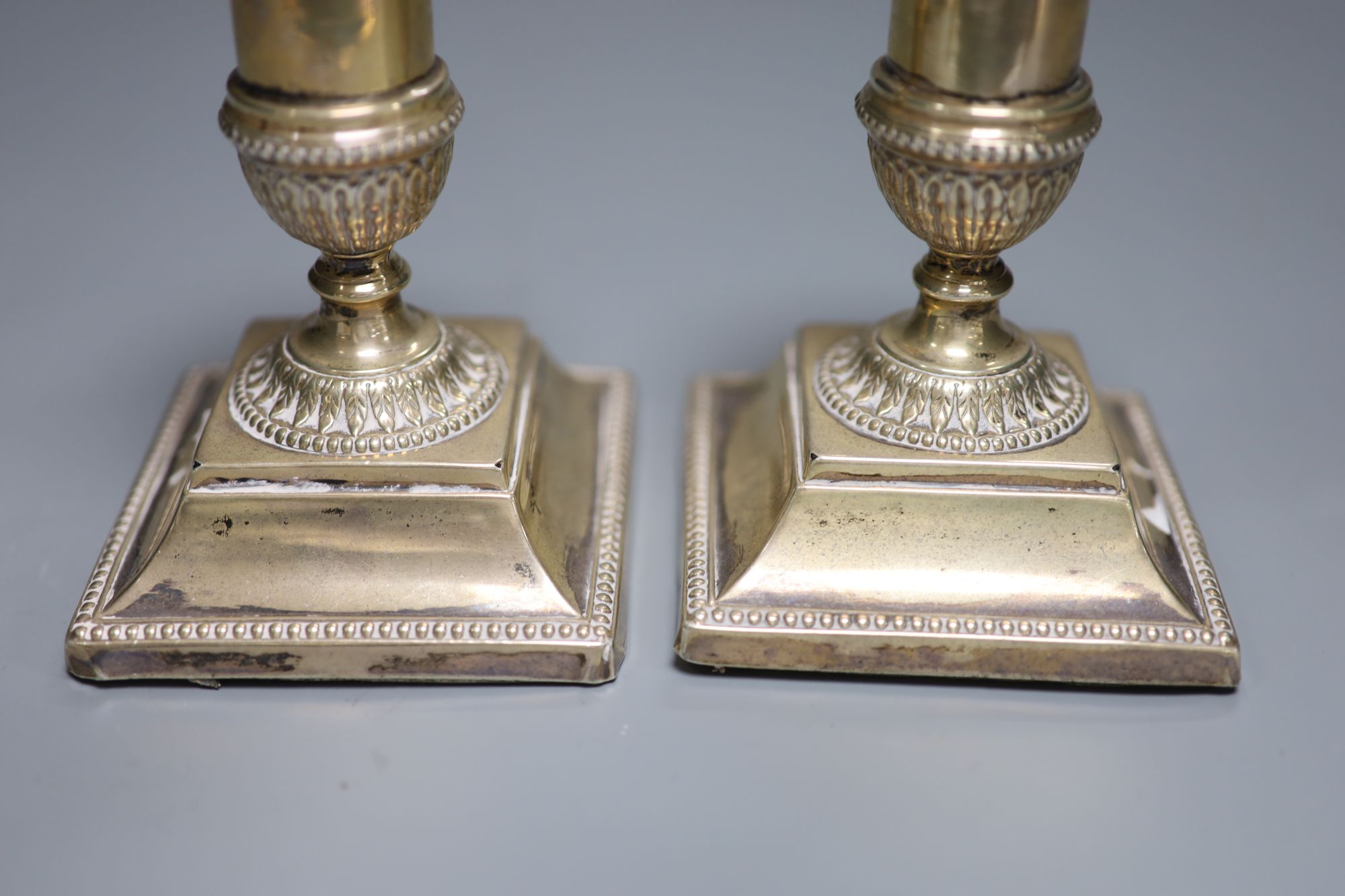 A pair of late Victorian silver dwarf candlesticks, Josiah Williams & Co, London, 1892, 11.1cm, weighted.